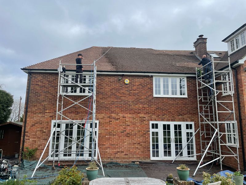 Roof cleaning carried out safely from scaffold towers by The Roof Moss Cleaners in Malmesbury